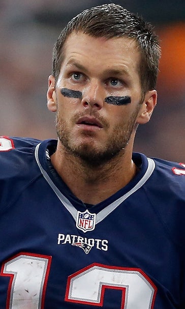 PHOTO: Tom Brady impostor runs marathon while juggling deflated footballs
